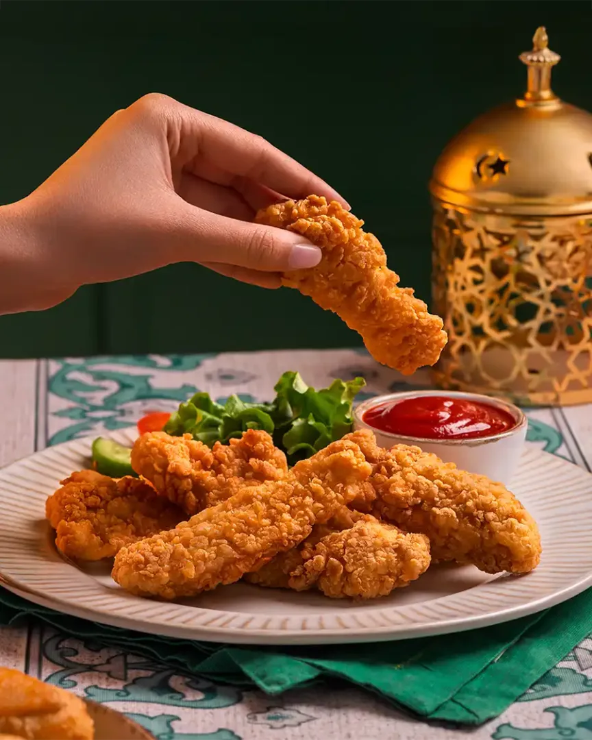 svg+xml;charset=utf - Irresistible Food Photography food photography egypt - commercial food photography for Halwani Bros Ramadan advertising campaign showing plate of chicken strips