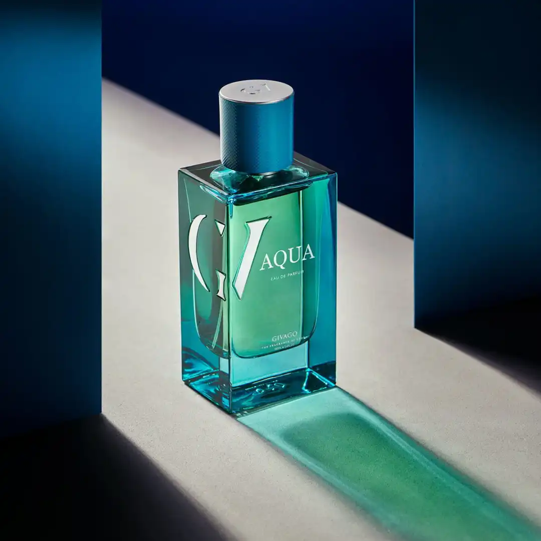 Givago Aqua perfume photography © Mechanix Studios Givago Aqua turquoise perfume bottle in a beam of light between blue walls