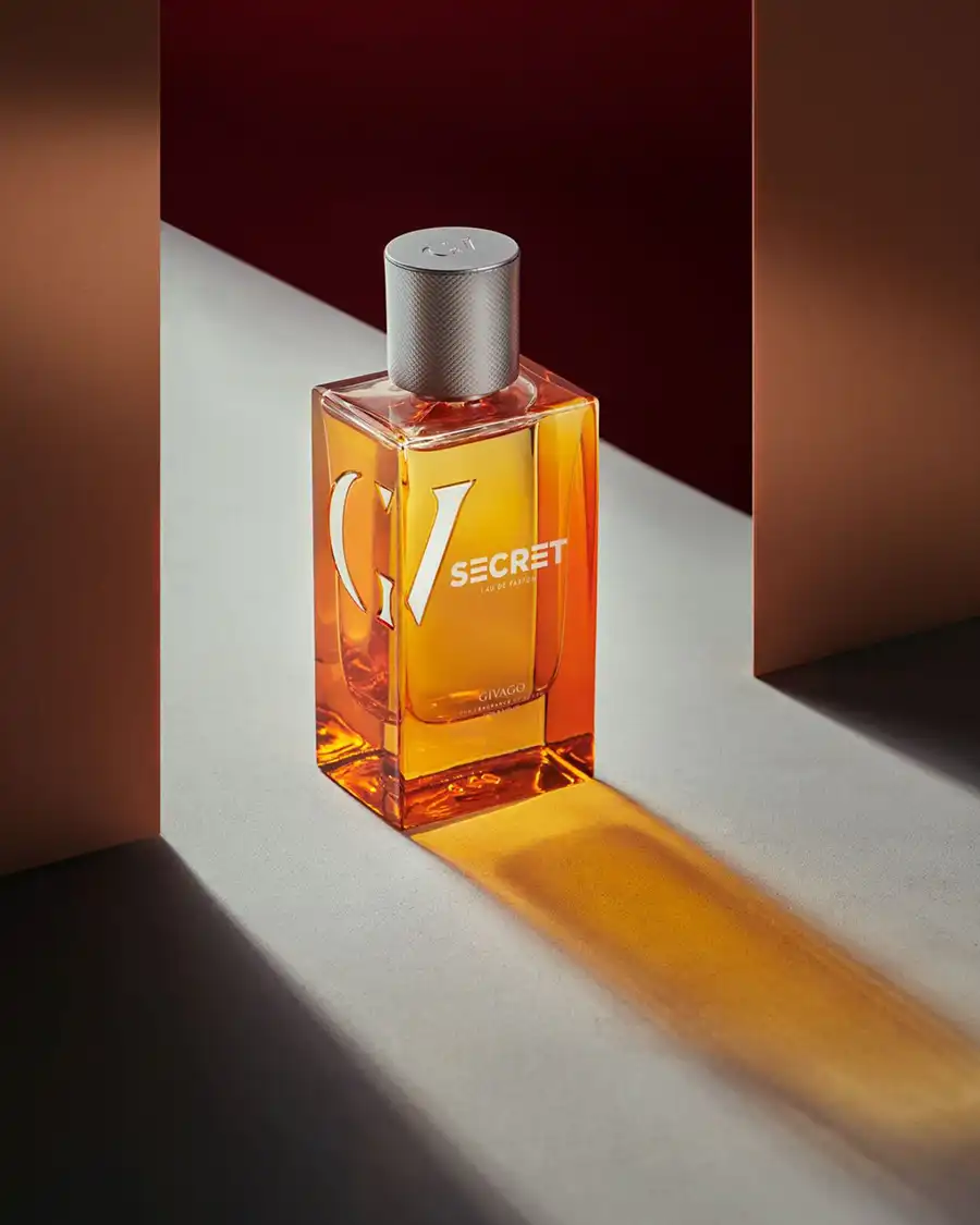 svg+xml;charset=utf - commercial photography studio Egypt Givago Secret perfume photography: amber glass bottle in a hard beam of light between terracotta walls