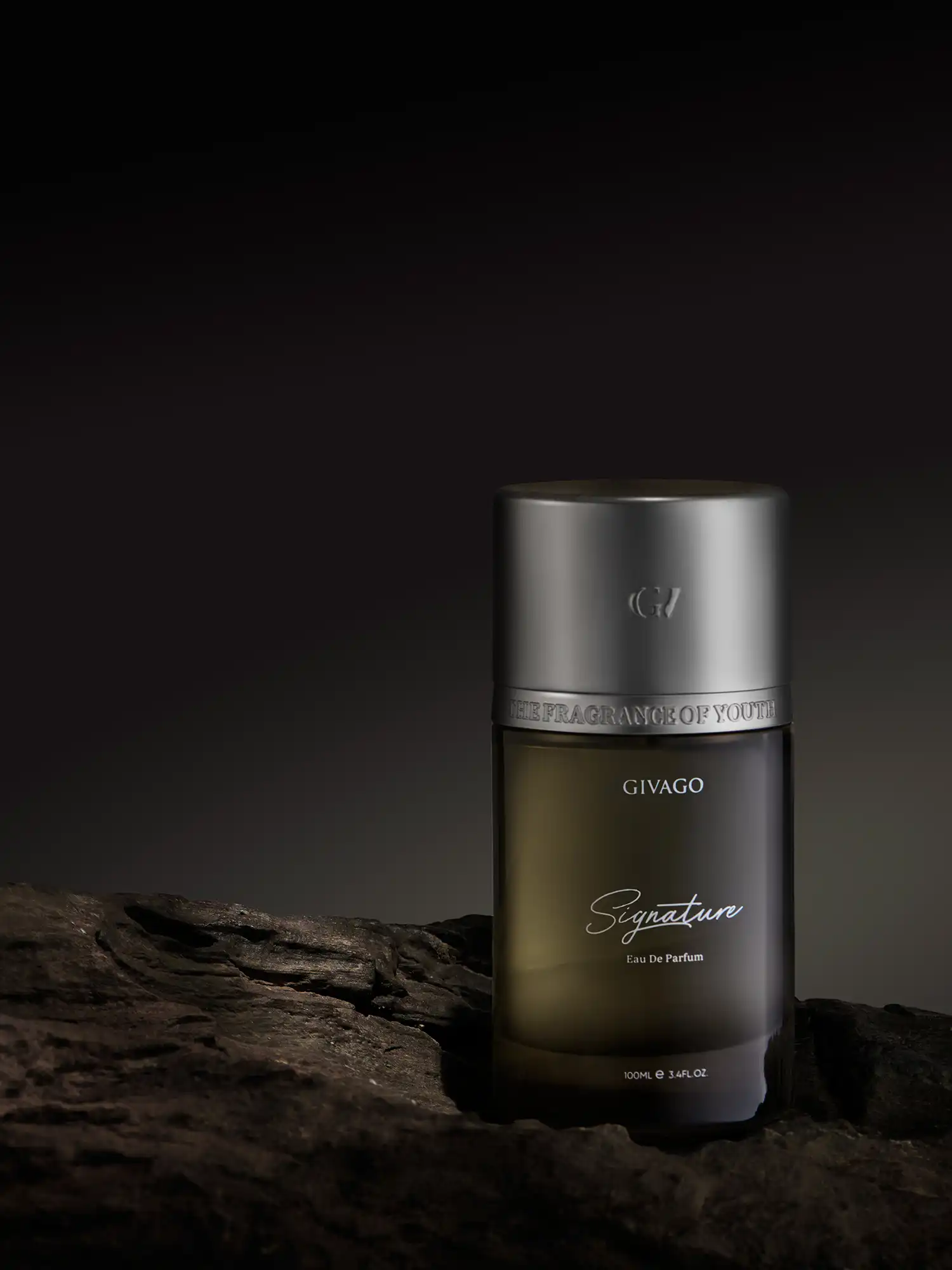 Givago Signature perfume bottle on rough dark rock in low-key light
