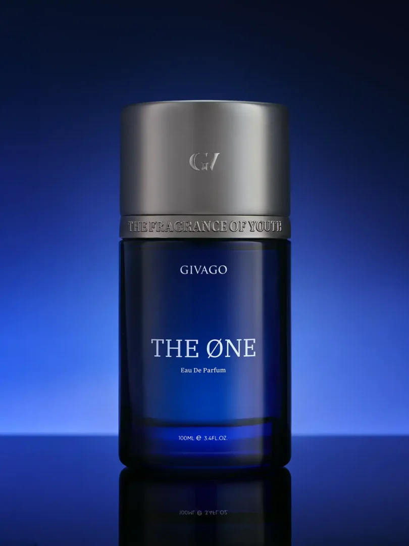 svg+xml;charset=utf - givago prince of oud perfume photography Givago The One perfume photography: blue bottle on a reflective surface with a blue horizon glow